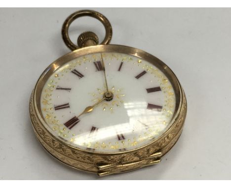 A gold fob button wind pocket watch the enamel dial with Roman numerals mark 14 k