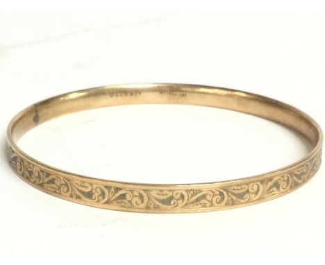 A 9ct metal core bangle , 21.1g postage cat B