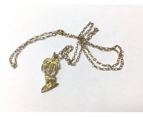 A 14ct gold Hawaii pendant with a 9ct gold chain.( A) 2g.