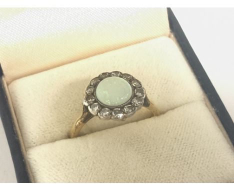 An 18ct gold ring set with an opal stone , size M , 3.8 g. Postage cat A