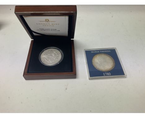 The last ever us Morgan dollar and a commemorative five dollar coin for the first men on the moon. As well as an American buf