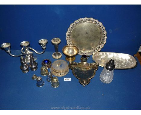 A quantity of epns including coasters, heavy embossed tray, condiment set, sugar sifter, serving dish and three candelabra, e