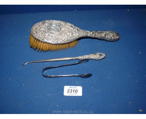 A Silver backed hair Brush, (Birmingham) and button hook together with epns sugar tongs.