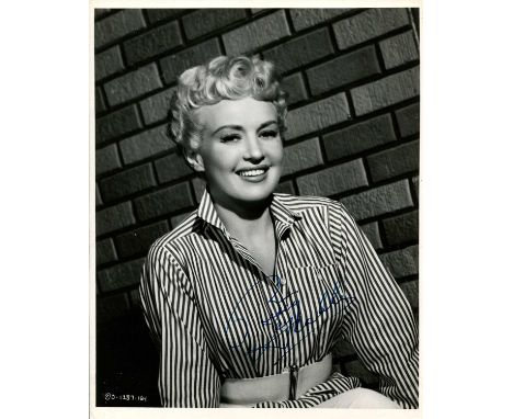 GRABLE BETTY: (1916-1973) American dancer, singer and actress, the number one pin-up girl of World War II. Vintage signed 8 x