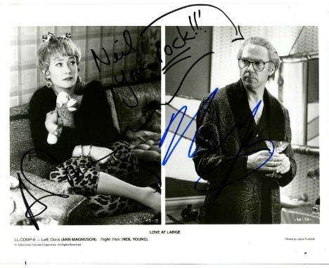 LOVE AT LARGE: Signed 10 x 8 photograph by both Neil Young (Rick) and Ann Magnuson (Doris) individually, the composite image 