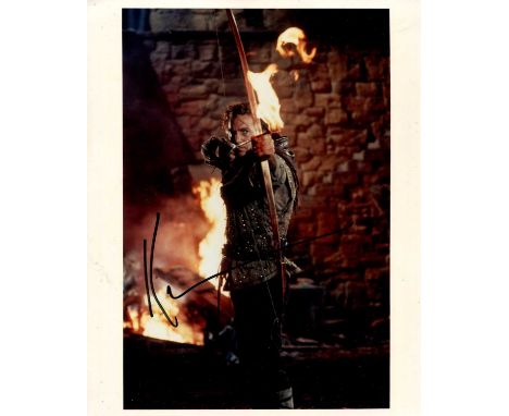 COSTNER KEVIN: (1955- ) American actor, Academy Award winner. Signed colour 8 x 10 photograph of Costner standing in a classi