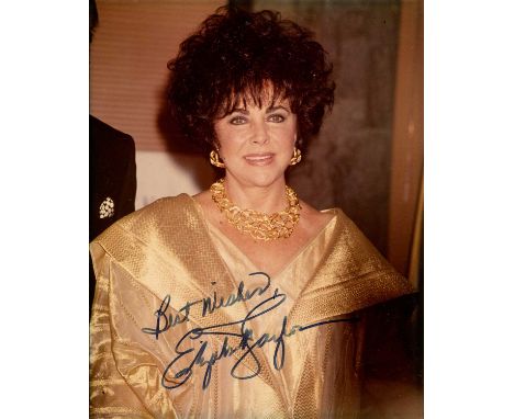 TAYLOR ELIZABETH: (1932-2011) British actress, Academy Award winner. Signed colour 8 x 10 photograph of Taylor standing in a 