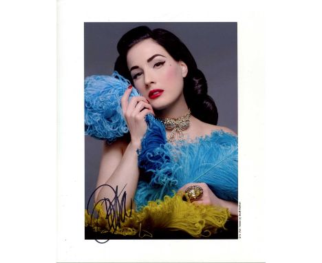 VON TEESE DITA: (1972- ) American vedette, burlesque dancer and model. Signed colour 8 x 10 photograph of Von Teese in a head