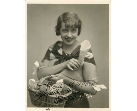MISTINGUETT: (1873-1956) French actress and singer. Vintage signed and inscribed 9 x 11.5 photograph of the entertainer stand