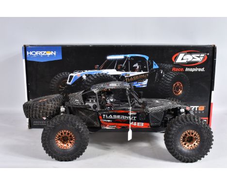 A BOXED HORIZON HOBBY LOSI TENACITY 1:10 SCALE 4WD LASERNUT ROCK RACER REMOTE CONTROLLED CAR, heavy built metal frame with ca