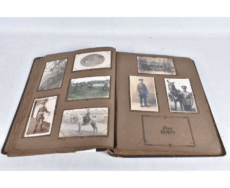 OVER FOUR HUNDRED POSTCARDS AND PHOTOGRAPHS CONTAINED IN AN ALBUM and featuring many different eras from WWI to WWII and late