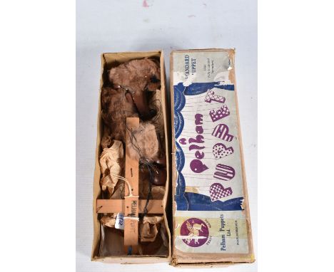 A BOXED PELHAM WOLF PUPPET, appears complete and in fairly good condition with some paint loss, marking and wear, contained i