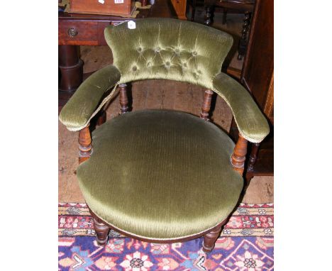 A Victorian tub chair with button back and turned front supports