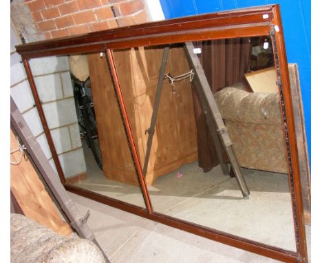 A large mahogany framed mirror