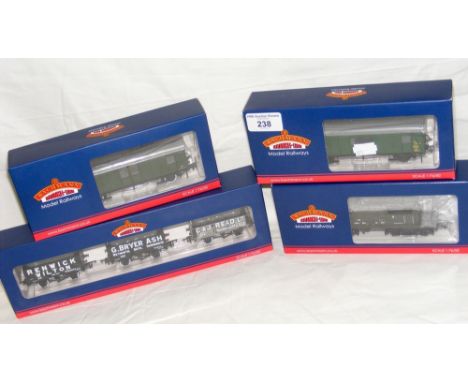 A boxed Bachmann set of tank wagons, together with three other rolling stock