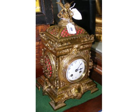 An attractive antique French brass bracket clock with chiming movement and cherub mount - 36cm high