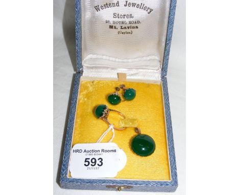 A jade pendant, ring and clip-on earrings set
