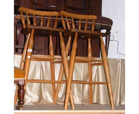 A pair of stick back bar stools