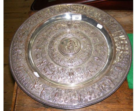 A 45cm diameter silver plated Elkington charger depicting classical scenes, having lozenge to back marked "V R Art Foundation