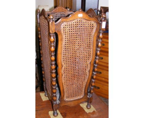 An old oak and cane work stick/umbrella stand