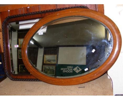 Oval antique wall mirror, together with one other