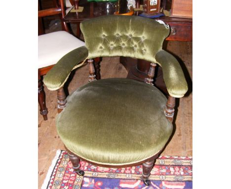 A Victorian tub chair with button back and turned front supports