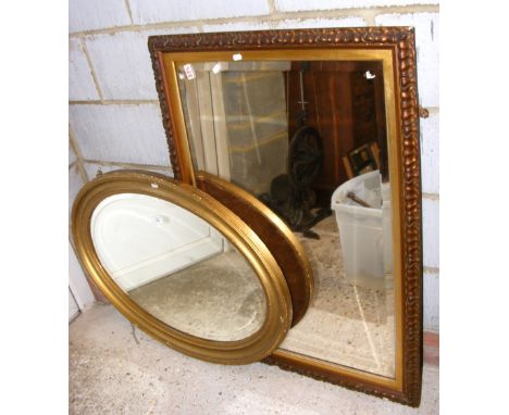 An oval wall mirror, a bevelled wall mirror, together with a small kitchen table