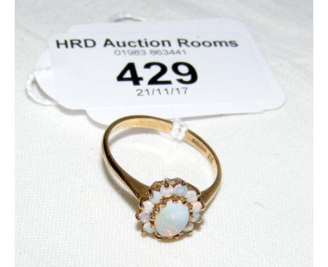 An opal cluster ring in 9ct gold setting