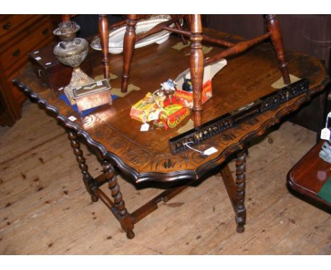 Oak gate-leg table with carved top