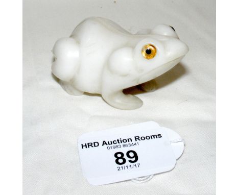 An unusual Chinese white jade carving of a toad with glass eyes - 7cm