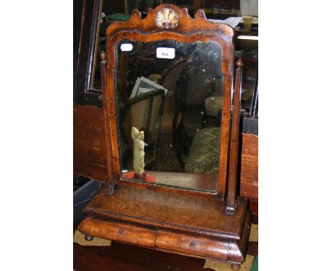 An antique walnut toilet mirror with two drawers to the base