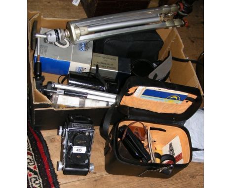 An old Mamiyaflex camera in original case with booklet, together with other camera lenses, tripods, etc.