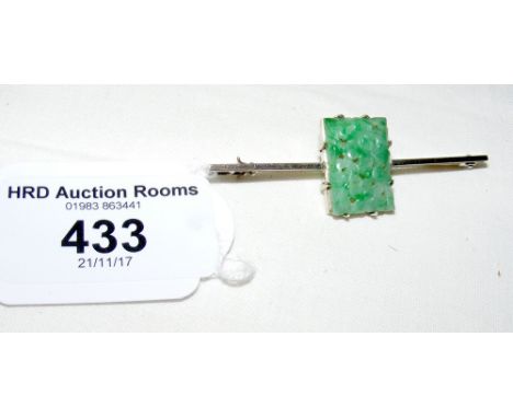 A jade brooch in 9ct gold setting