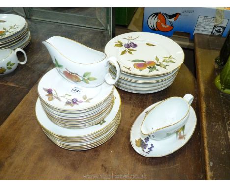 Eight large Royal Worcester Evesham china dinner plates, eight dessert plates, eight side plates, a gravy boat and saucer wit