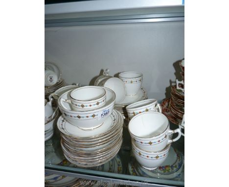 A part tea-set by Royal Albert Crown china to include eight cups (two with hairline cracks), twelve saucers, twelve tea plate