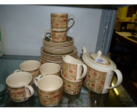 A quantity of Johnson Brothers tea-ware including a teapot, eleven tea plates, eight saucers, six cups, large plate, sugar bo