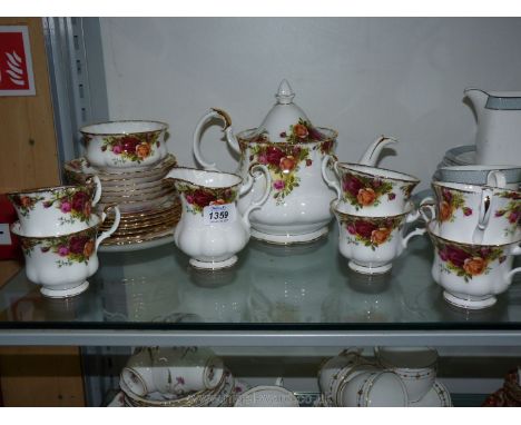 A Royal Albert 'Old Country Roses' Teaset for six with teapot, sugar bowl, milk jug and bread and butter plate.