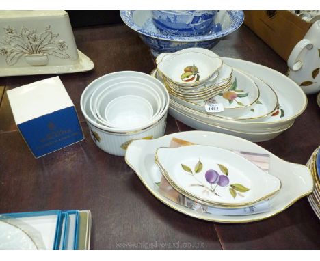 A graduated set of four Evesham pattern by Royal Worcester souffle dishes, miscellaneous gratin dishes and four oval serving 
