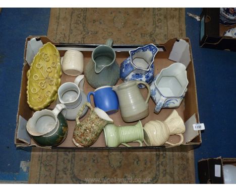 A quantity of Jugs including Masons, Poole, Staffordshire, yellow Sylvac bud vase, etc.