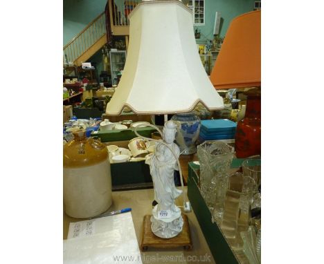 An oriental porcelain table Lamp with porcelain lady detail, 27'' tall on wooden plinth.