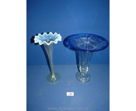 A tall glass vase with a flat top tinged with blue plus one other stem vase with opal fluted rim 11" tall.