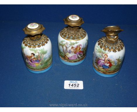Three ormolu and ceramic scent Bottles; (hinge broken on one lid, stopper missing from another bottle). 
