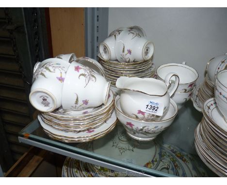 A part tea-set by Royal Standard Fancy Free pattern:  nine cups, twelve saucers, eleven tea plates, two bread/butter plates, 