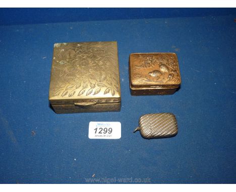 Two continental brass trinket boxes, the largest wooden lined, and a silver plated vesta case.