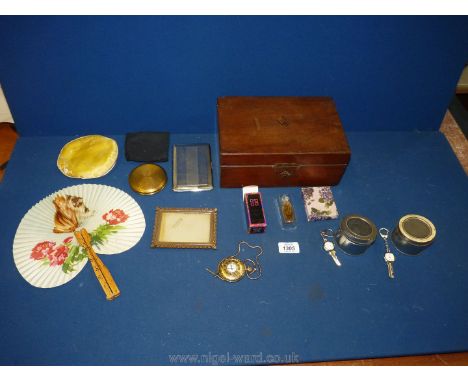 An old wooden sewing box with miscellaneous contents including two watch key rings, compact, cigarette case, yellow metal Avi