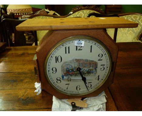 A rectangular Oak cased top-mounting, double-faced Station platform style Clock, the faces with Arabic numerals having applie