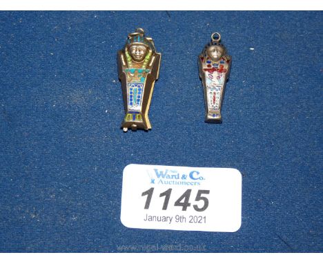1920's Egyptian revival:  a collectible white metal enamel mummy sarcophagus opening to reveal a vacant interior and a simila