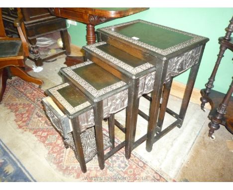 A Nest of four dark-wood Chinoiserie occasional Tables, the smallest unusually having a frieze drawer, the largest 21' 'x 14 