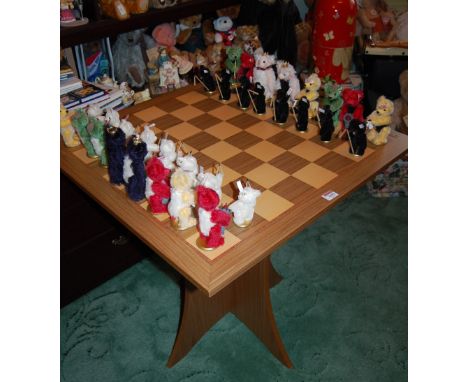 A Steiff full chess set, in black and white, king h.13cm, No.656118, with original Steiff marquetry chess table, with boxes