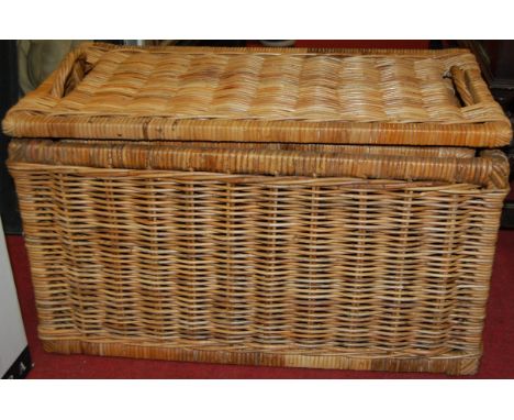 A pair of graduated wicker hamper type boxes